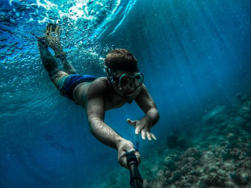Snorkeler With An Underwater Action Camera